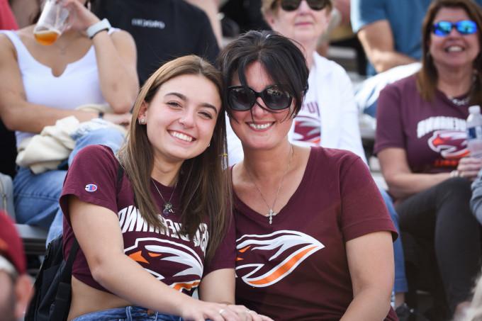 photo of mother and daughter at football game